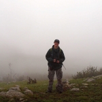Dr. Kate Jenks, Conservation Biologist at Minnesota Zoo, surrounded by rain and mist while conducting fieldwork in Hustai National Park, Mongolia. Photo by Nandintsetseg Dejid